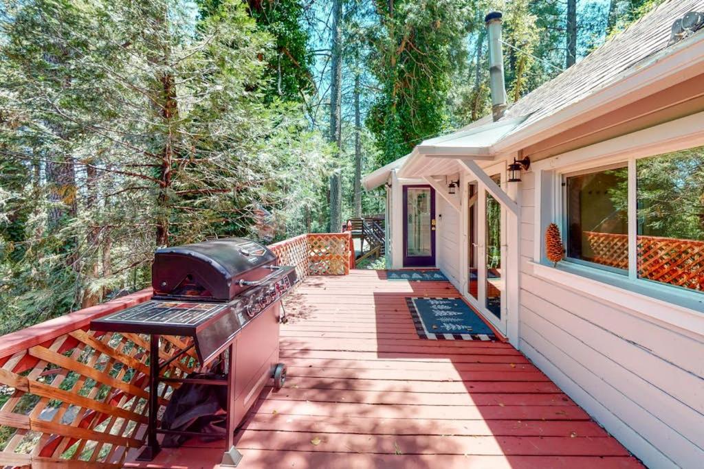 a grill on a porch of a house at Top Town Retreat in Crestline