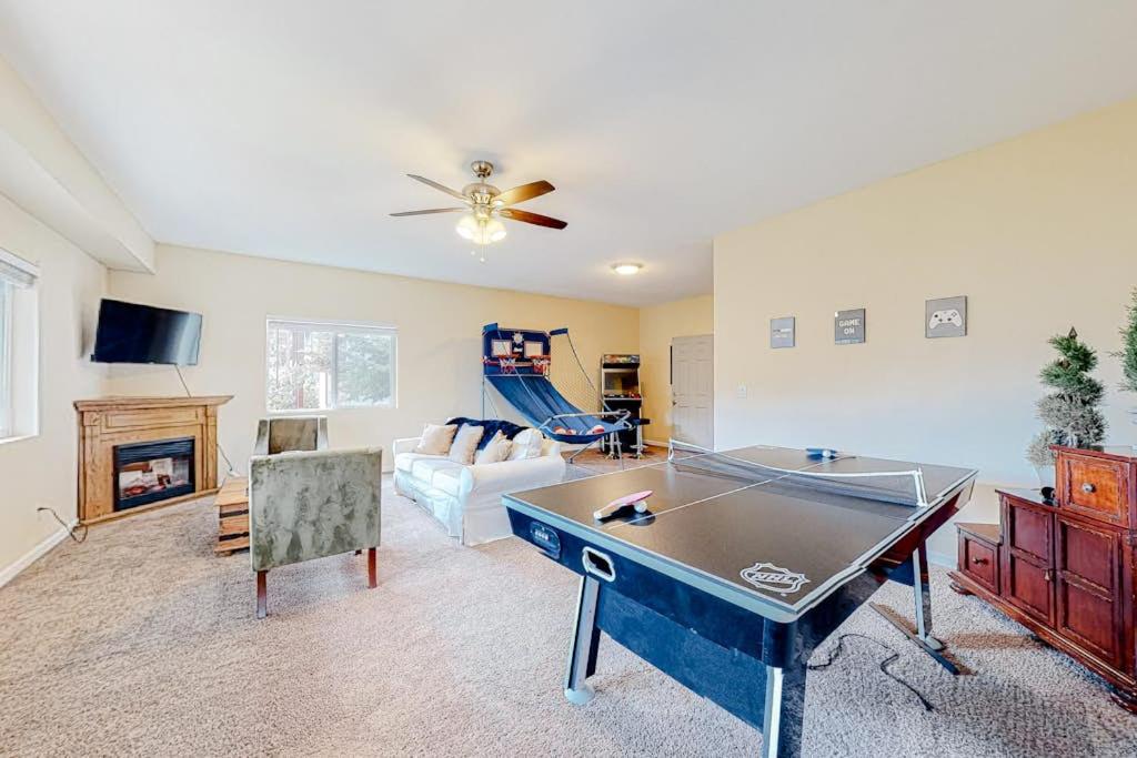 a living room with a ping pong table in it at Deer Mountain in Lake Arrowhead