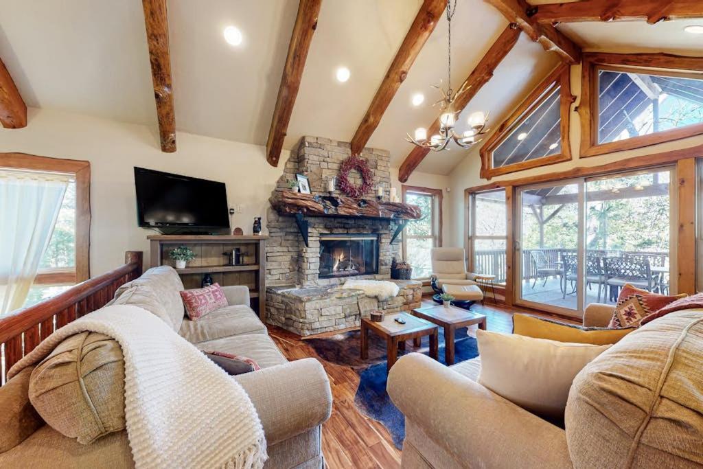 a living room with a couch and a fireplace at Arrowhead Haven in Lake Arrowhead