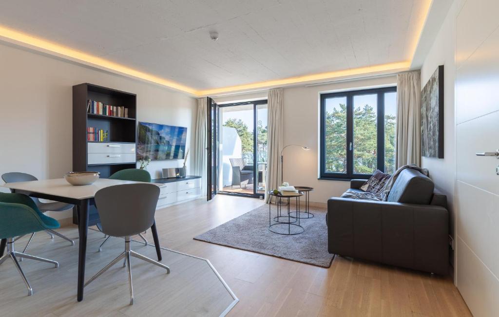 a living room with a table and a couch at Princess in Binz