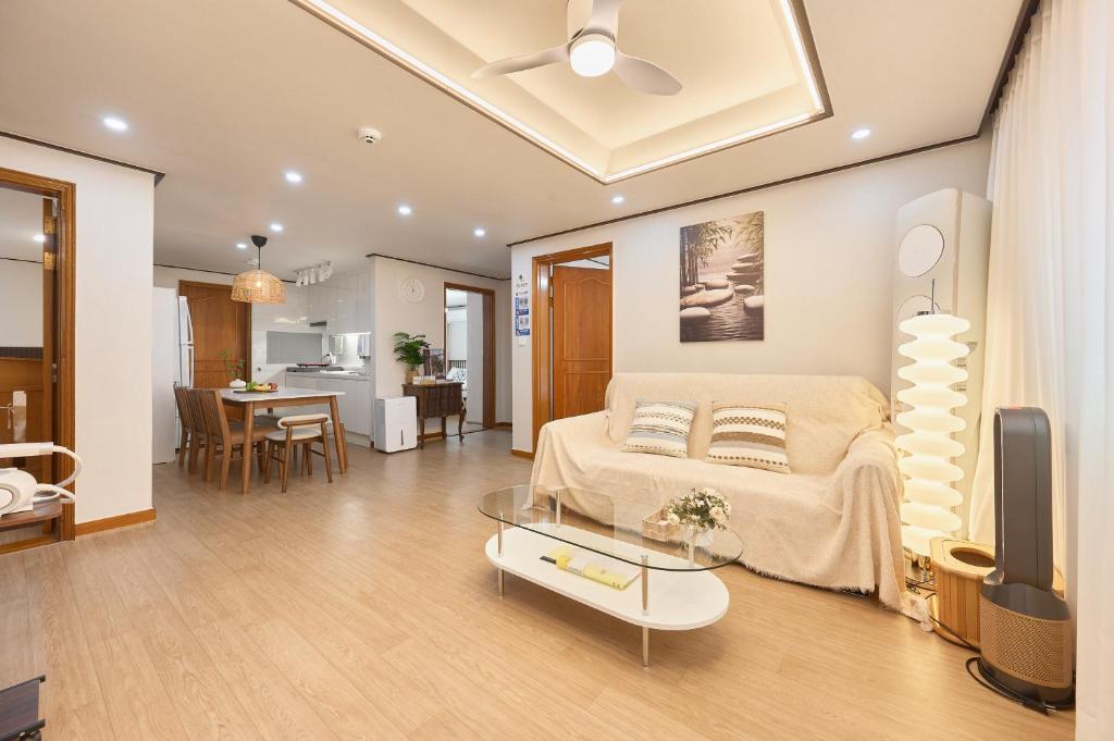 a living room with a bed and a table at Stay GAON in Seoul
