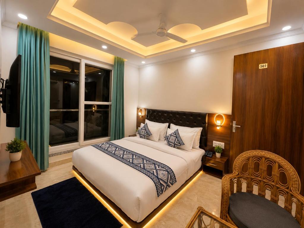 a hotel room with a bed and a window at Sitara Premium Gangotri Palace, Tapovan in Rishīkesh