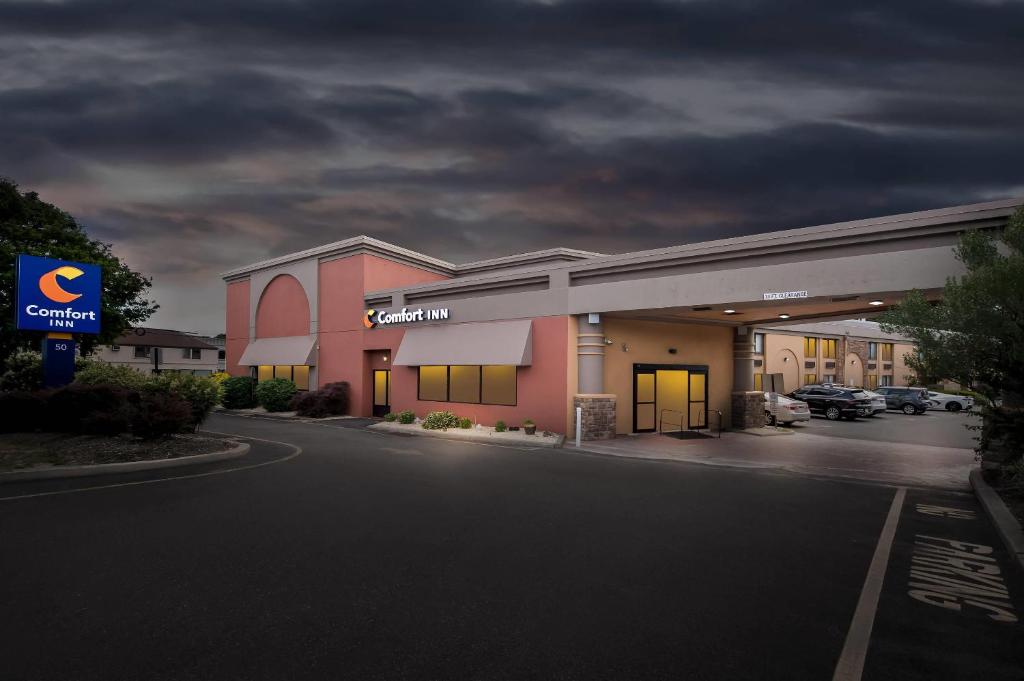 a gas station with a sign in a parking lot at Comfort Inn Paramus - Hackensack in Paramus