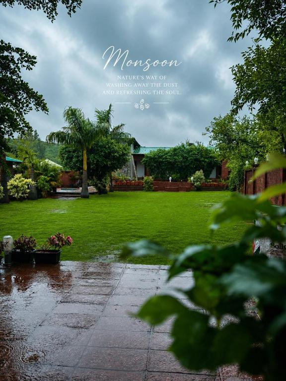 a picture of a yard with a lawn at La Serene Resort and Spa in Mahabaleshwar