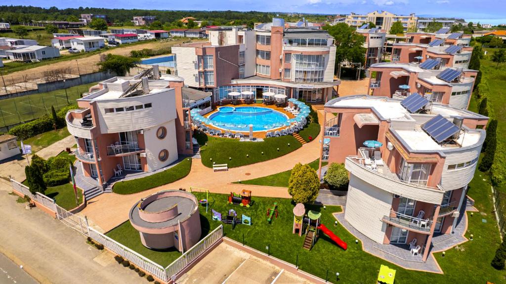 an aerial view of an apartment complex with a swimming pool at Arapya Resort in Arapya