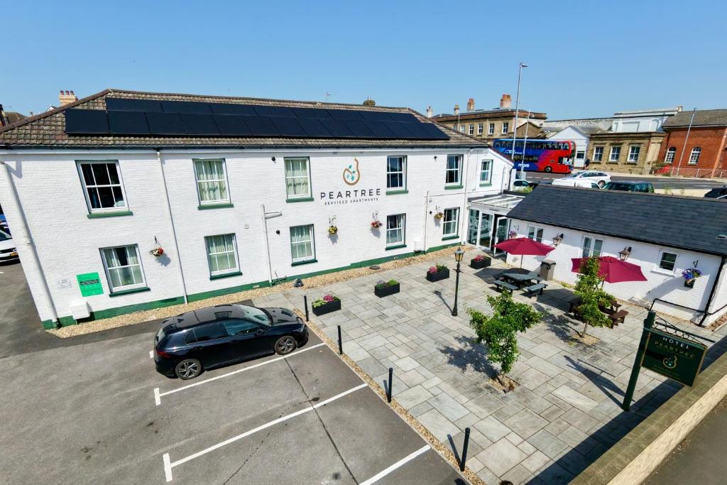 an aerial view of a building with a car parked in a parking lot at Peartree Serviced Apartments in Salisbury