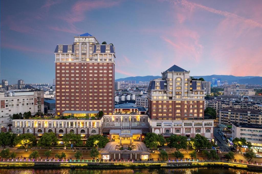 a view of a city with tall buildings at Grand Pacific Hotel Ningbo in Yuyao
