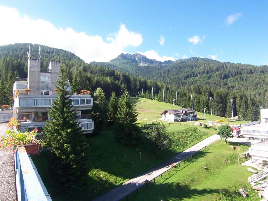 a view from the balcony of a house with a mountain at Res. Marilleva 1400 Apt.Solandra in Mezzana