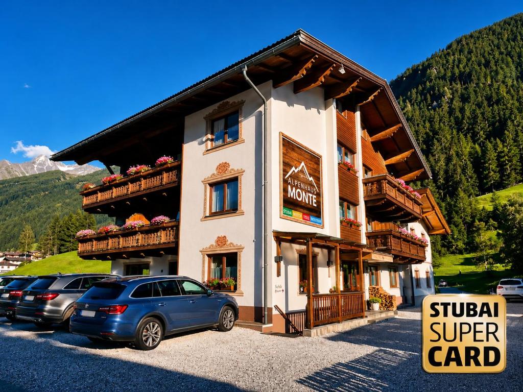 a building with cars parked in front of it at Alpenhaus Monte Bike & Hike in Neustift im Stubaital