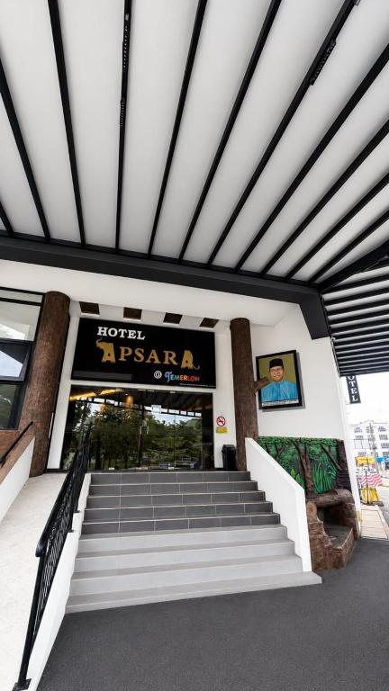 a building with stairs in front of a store at Hotel Apsara Temerloh Gateway in Temerloh