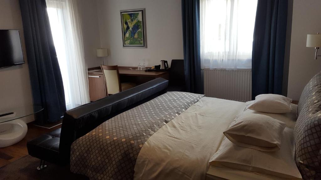 Postel nebo postele na pokoji v ubytování Residence Villa Karda