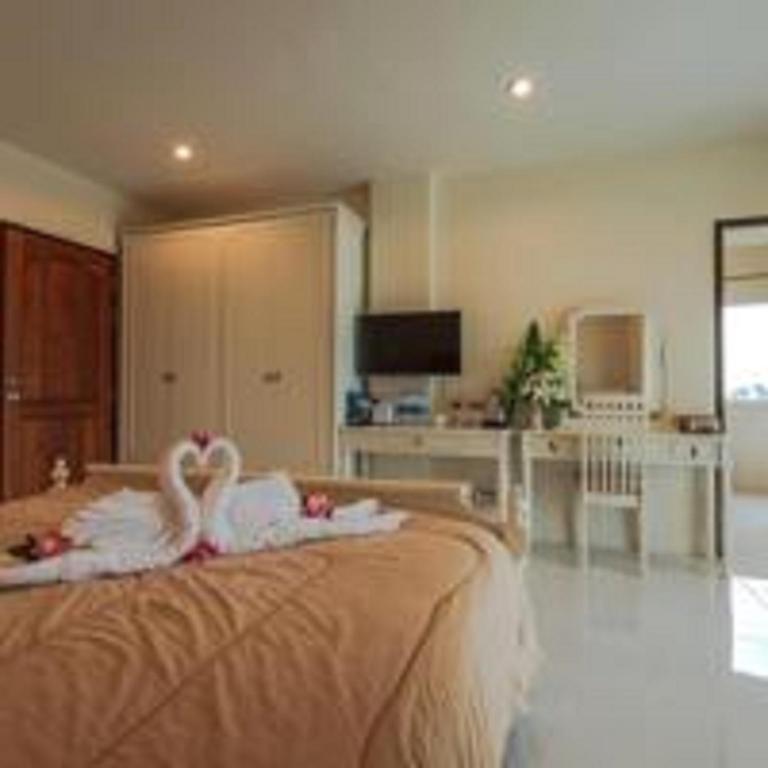 Postel nebo postele na pokoji v ubytování JS Residence Krabi