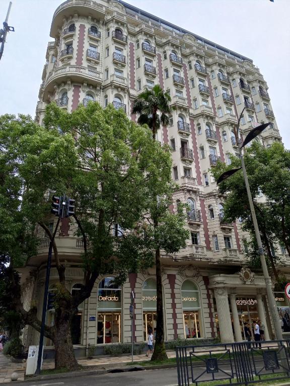 a large building on the corner of a street at 19 Rustaveli Ave in Batumi