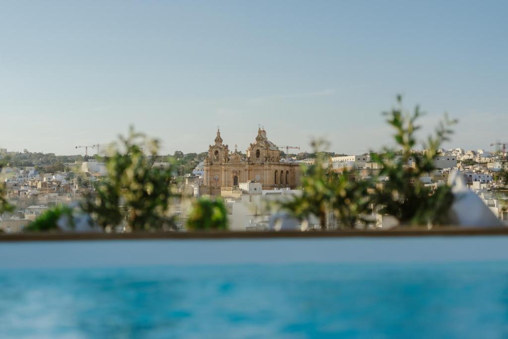 a view of a city from above the water at Royale Sainte Hélène Boutique Hotel in Birkirkara