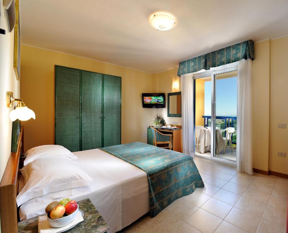 Postel nebo postele na pokoji v ubytování Hotel Bellevue