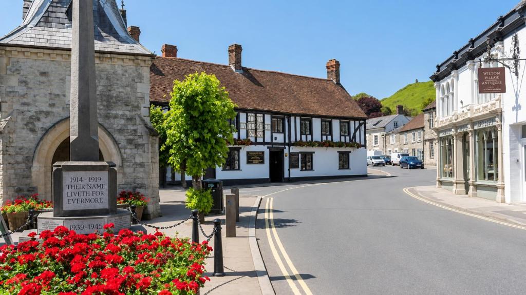 a street in a small town with flowers at George Inn, Mere in Mere