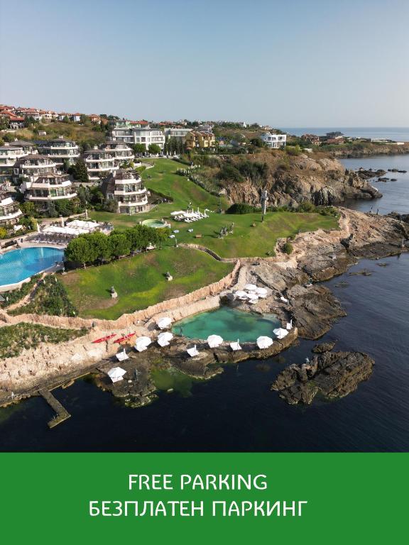 an aerial view of a golf course on a island in the water at Art Complex Anel in Sozopol