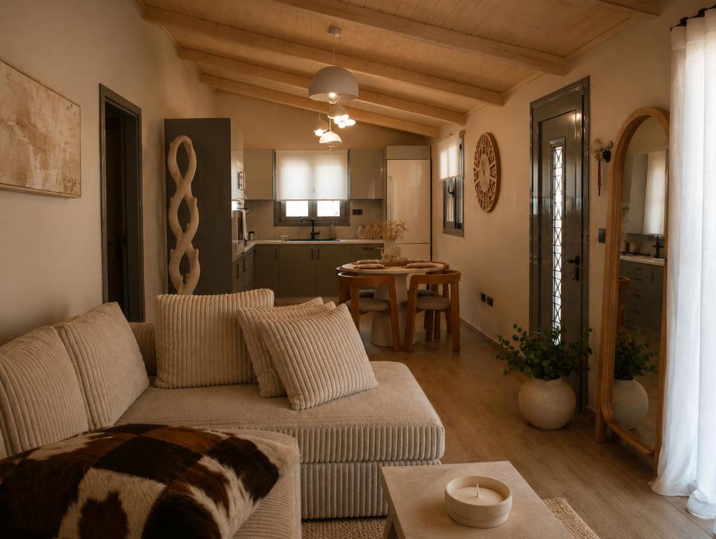 a living room with a couch and a table at Luxury casa in Nea Makri