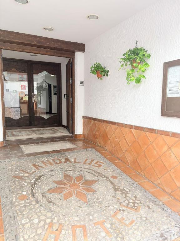 a room with a tile floor with a mosaic tile flooring at Hotel Alandalus in Torrox