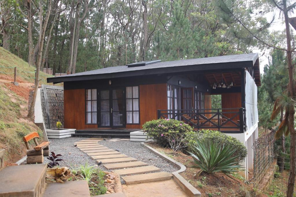 a small house with a pathway in front of it at Lake House Mantasoa in Mantasoa