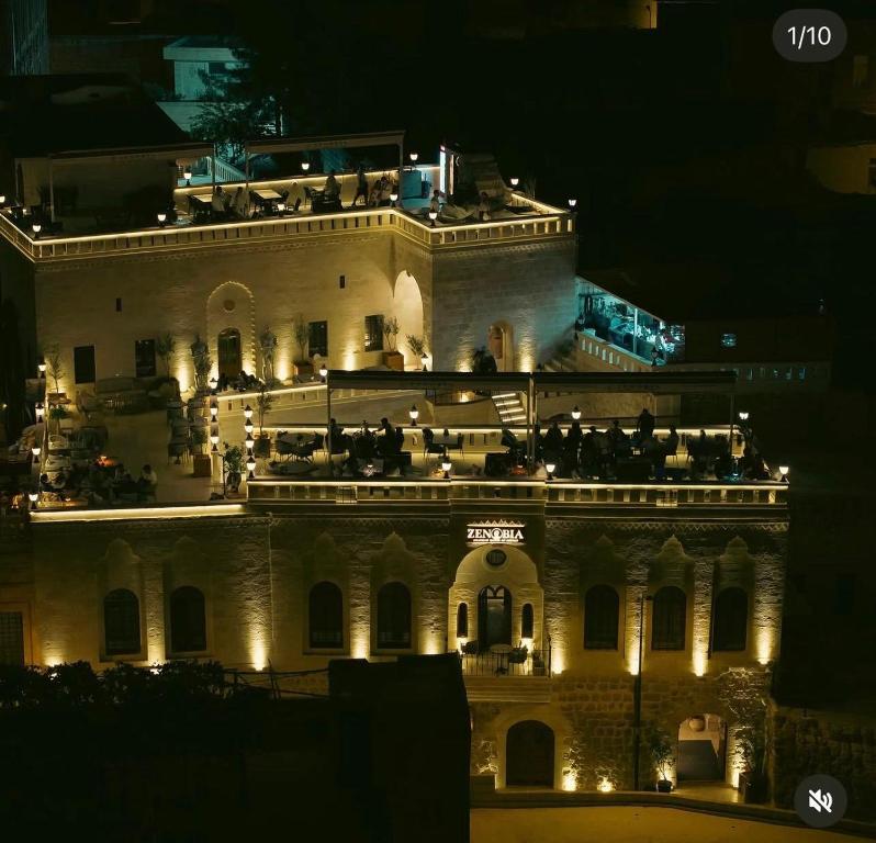 a large building with lights on it at night at Konak Zenobia in Midyat