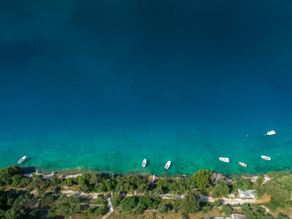 a group of boats floating in the water at Istria Sea Side Apartments Lina in Labin