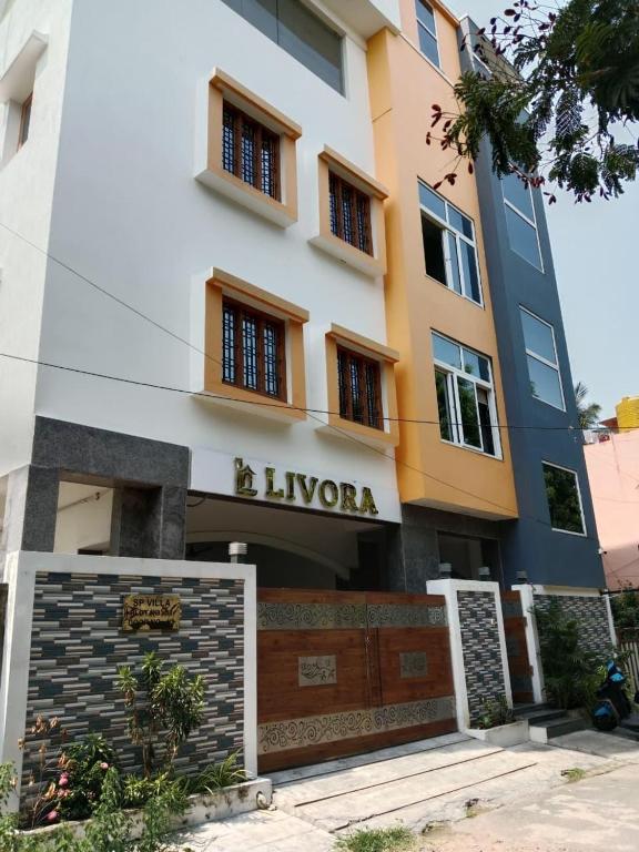 a view of the building of the luxury hotel at Livora Residency in Chennai
