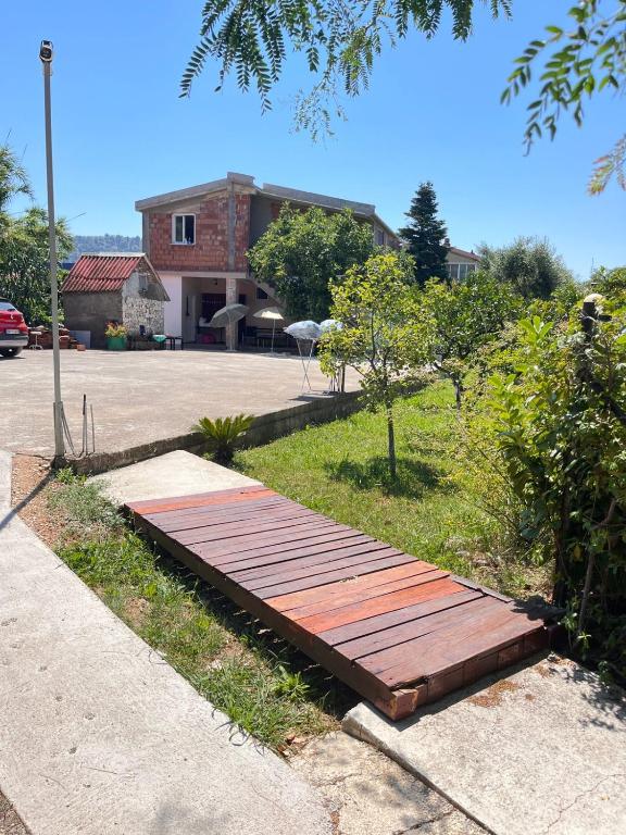 a wooden boardwalk on the side of a road at Apartman Jana in Bar