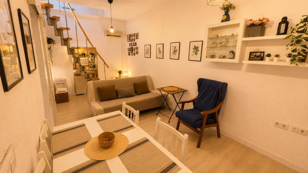 a living room with a couch and a table at Vejer de la Frontera Luis in Vejer de la Frontera