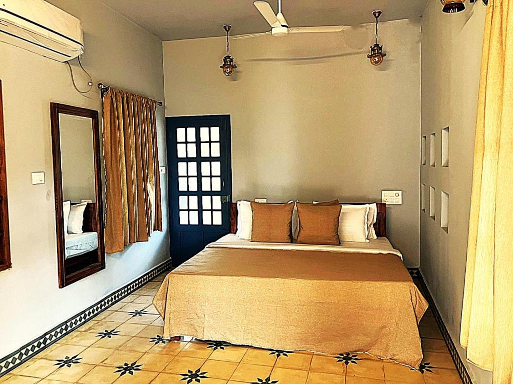 a bedroom with a large bed in a room at Aali villas in Mararikulam