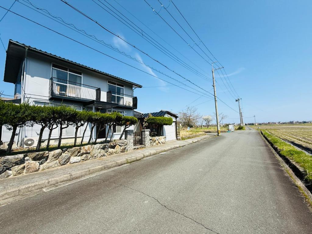 a house on the side of a road at Biwa Asahi 家族友人大人数ok BBQok in Takashima