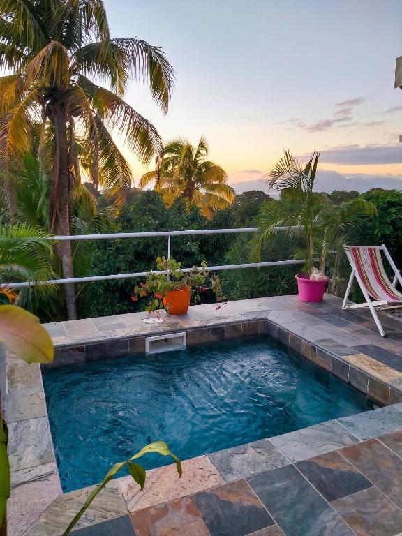 a swimming pool with a view of a resort at Appartement charmant à Sainte-Luce avec vue sur la montagne in Sainte-Luce