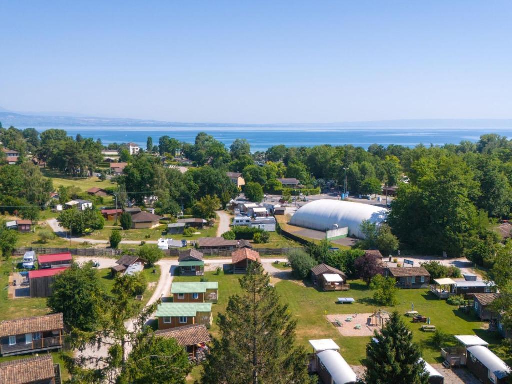 an aerial view of a small village with a farm at Camping Léman Plage in Excénevex