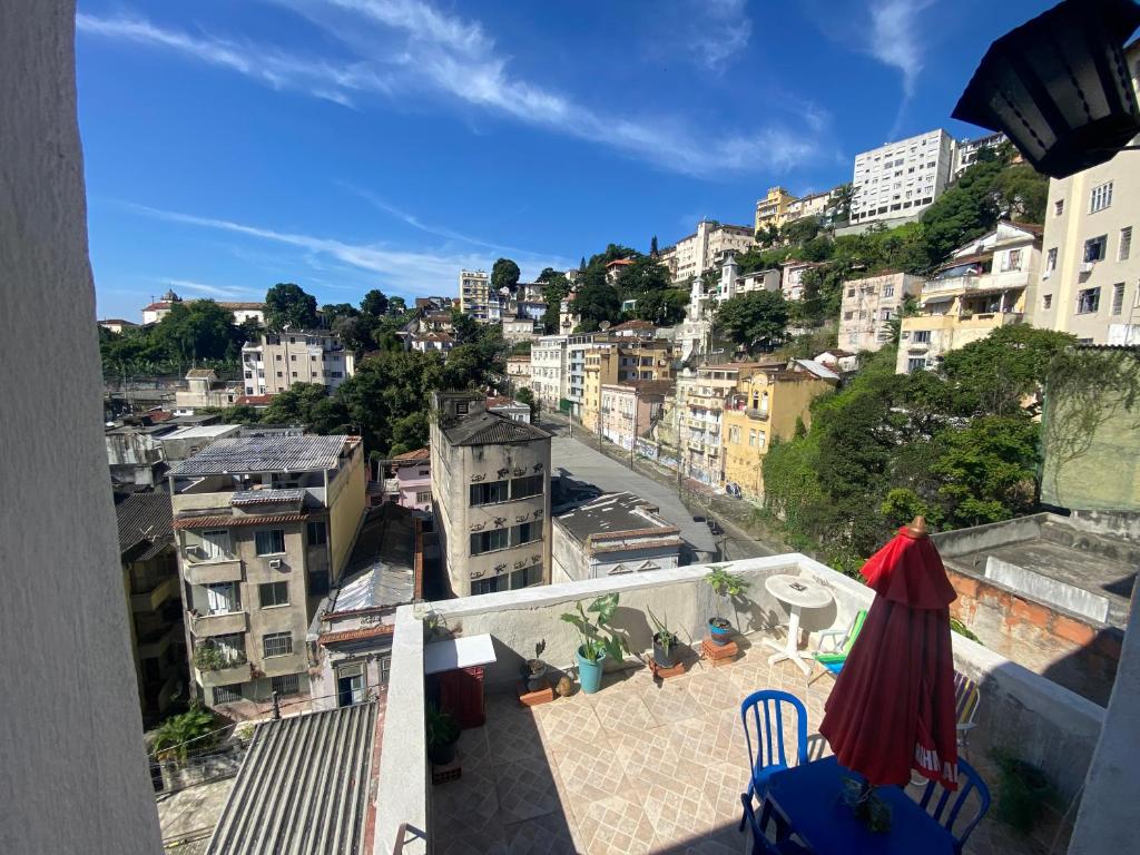 a view of a city from the balcony of a building at Carioca Lapa Hostel in Rio de Janeiro