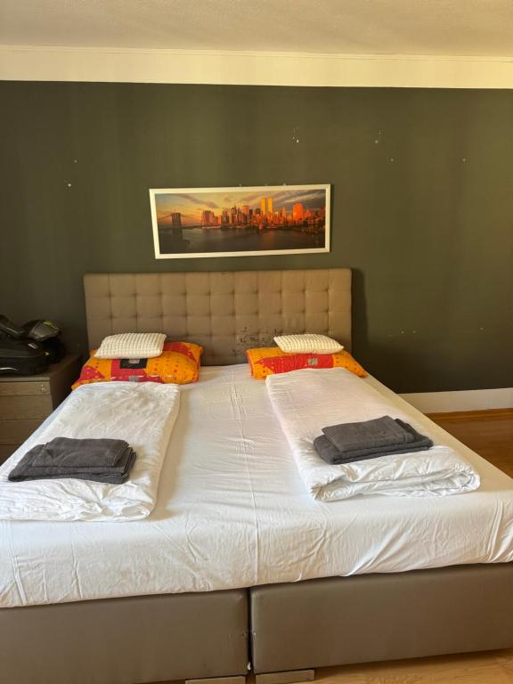 a bed with two pillows on it in a bedroom at Marivel Wohnung in Freudenstadt