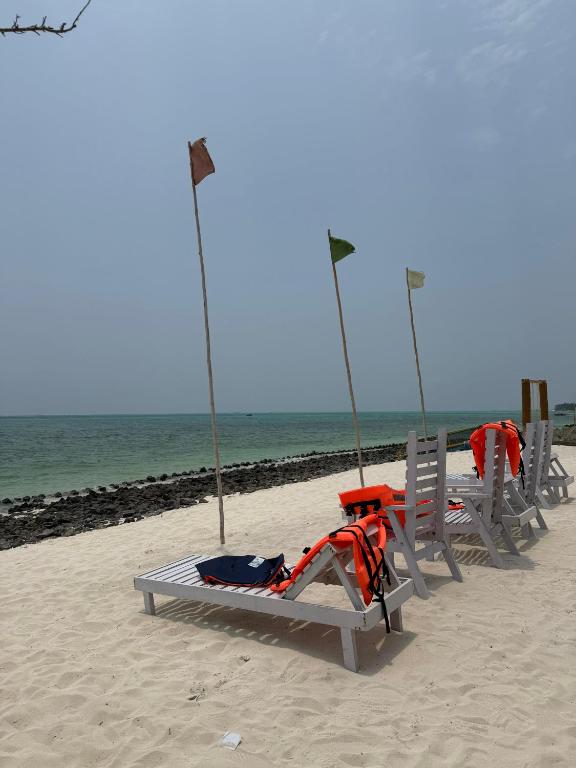 a group of swings on the beach at PP Beach Villa in Agatti