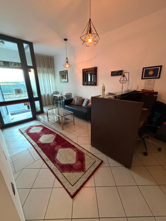 a living room with a couch and a table at M&M Rooms in Pannocchia