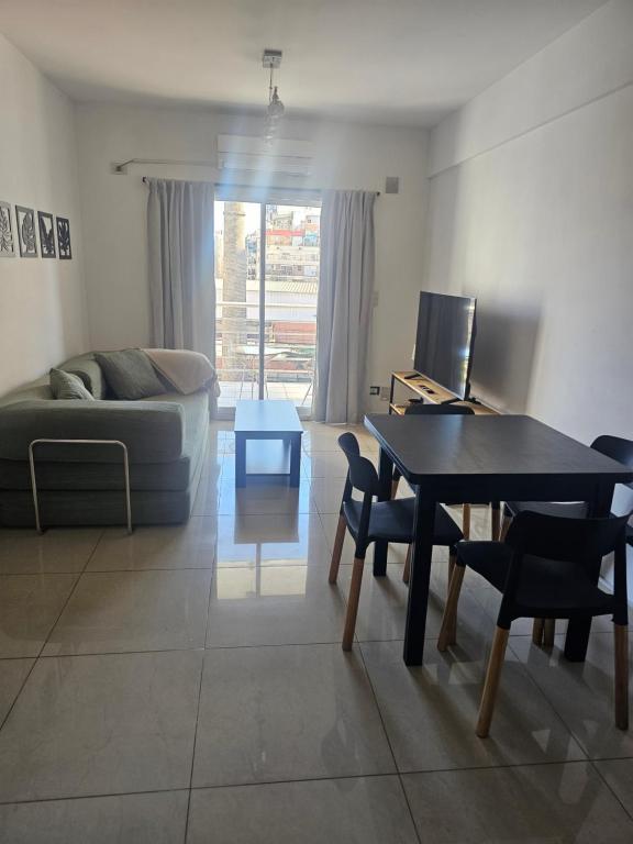 a living room with a table and a couch at Palermo Apart 2 in Buenos Aires