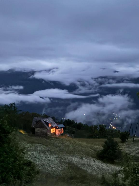 a house on top of a hill at night at JUSA ჯუსა in Kantauri