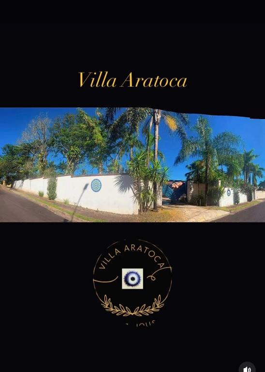 a sign that says villa aragonosa with a picture of a building at VILLA ARATOCA in Garça