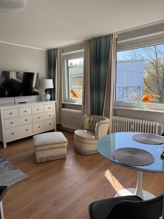 a living room with a table and a window at ZV38-Mammut-30 in Salzgitter
