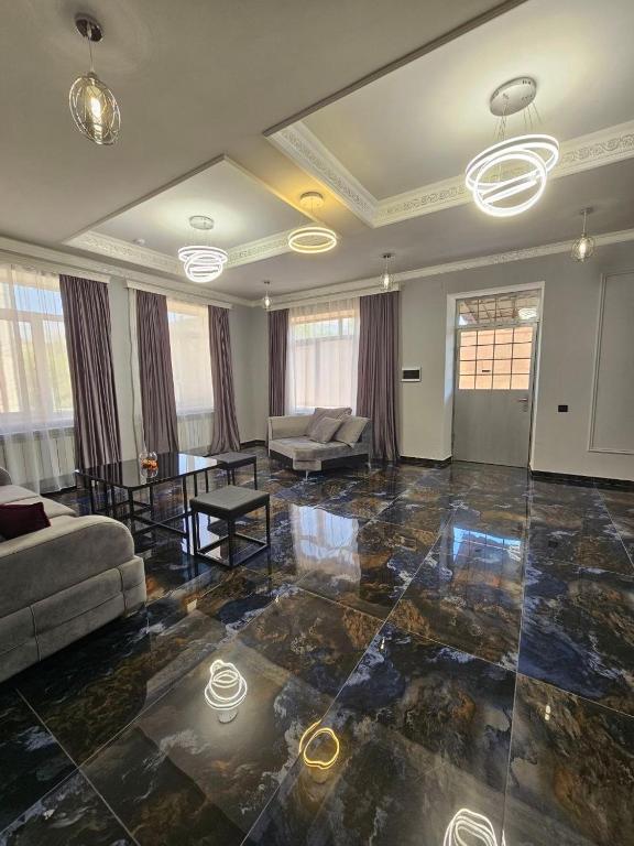 a living room with a couch and a table at Creative hotel in Gyumri