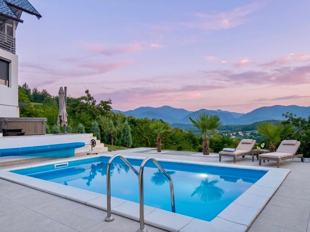 a swimming pool with a view of the mountains at Residence La Femme in Tuzla