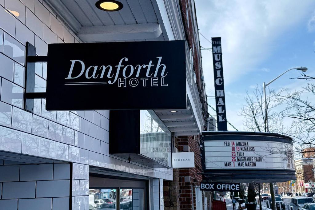a sign for a durant hotel on the side of a building at Danforth Hotel in Toronto