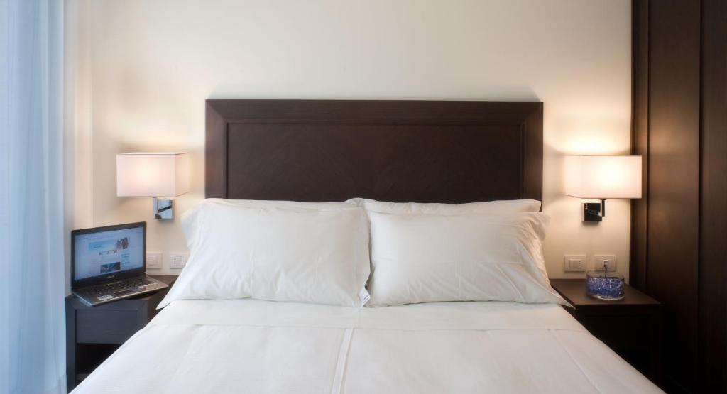 Postel nebo postele na pokoji v ubytování Hotel La Cappuccina