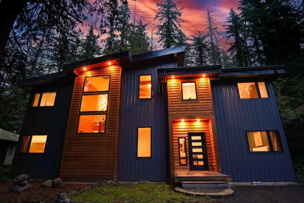 a house with lights on the front of it at Aspire at Mount Baker in Glacier