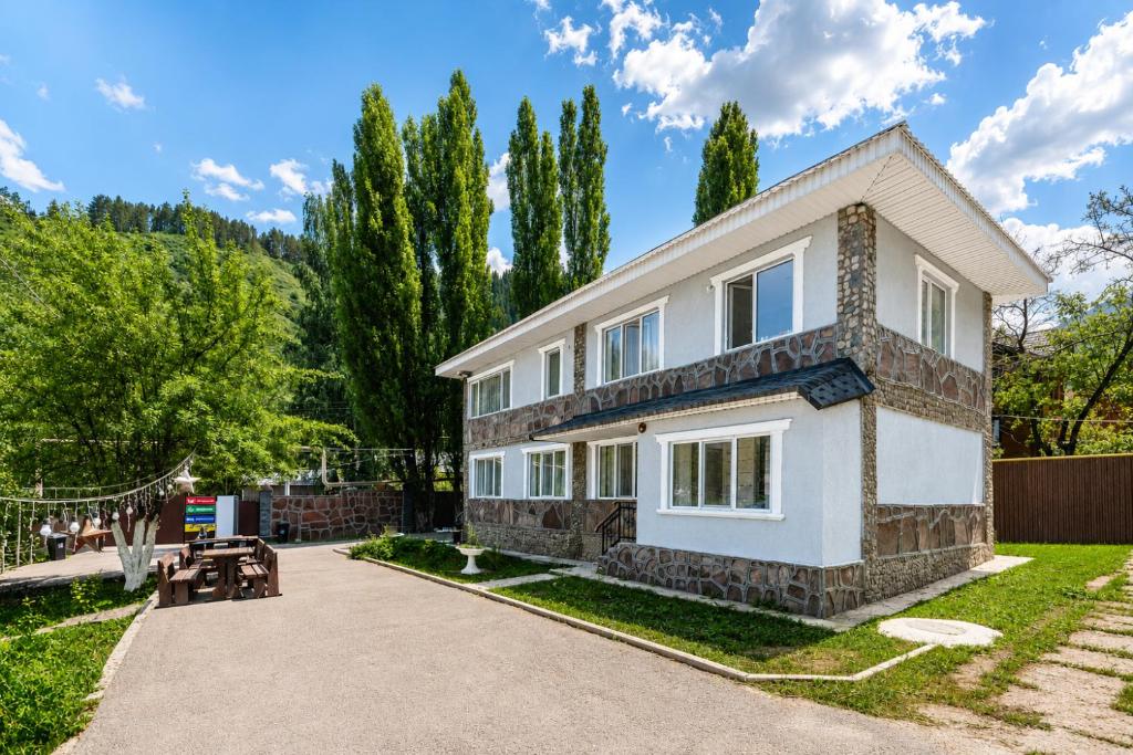 a house with a pathway leading to it at Tau Shyraq in Almaty