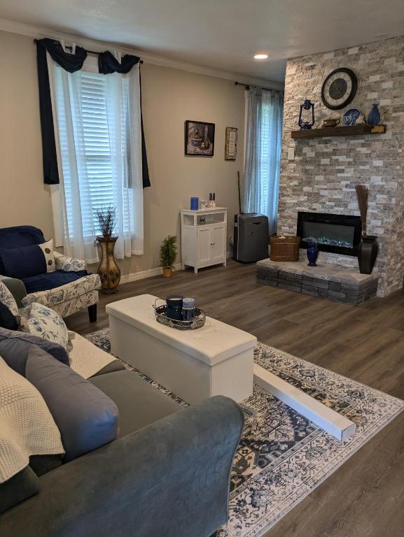a living room with a couch and a table at Country side house with with cozy 3 bedrooms and 2 bath in Minneola