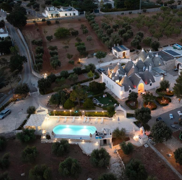 an aerial view of a house with a swimming pool at Masseria Carperi in Cisternino
