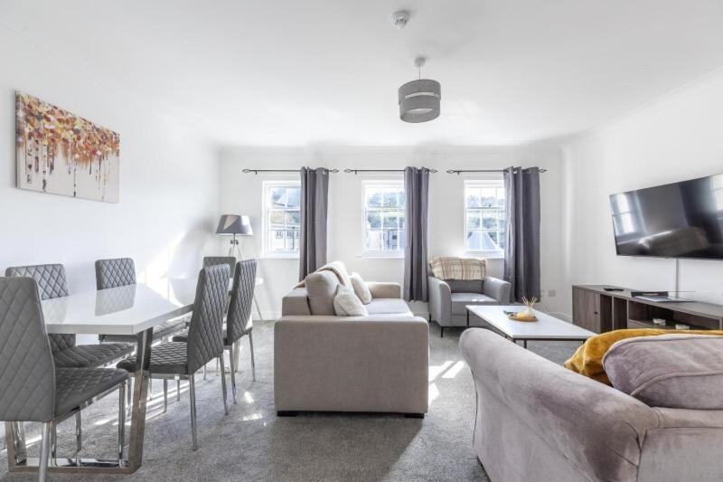 a living room with a couch and a table at Harbour View in Whitehaven